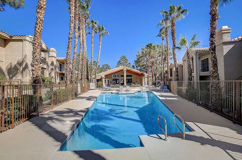 Pines Apartments community pool, lounge area, and grill, Exterior